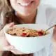 Eating a bowl of cereal with strawberries