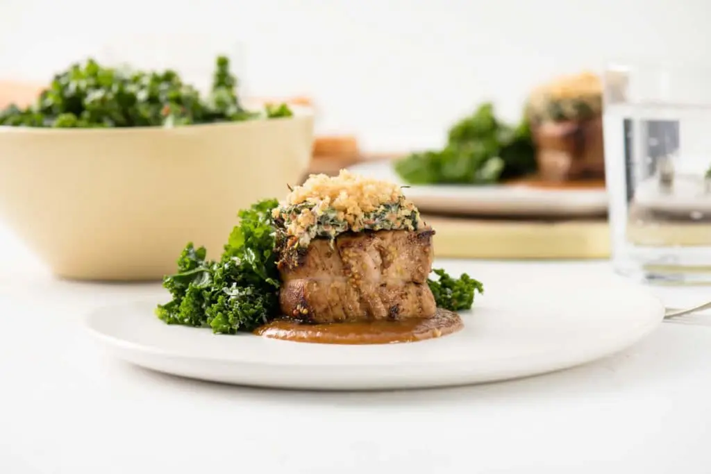 Mustard Greens Parmesan Crusted Pork Medallions with Mustard Ale Sweet Onion Sauce