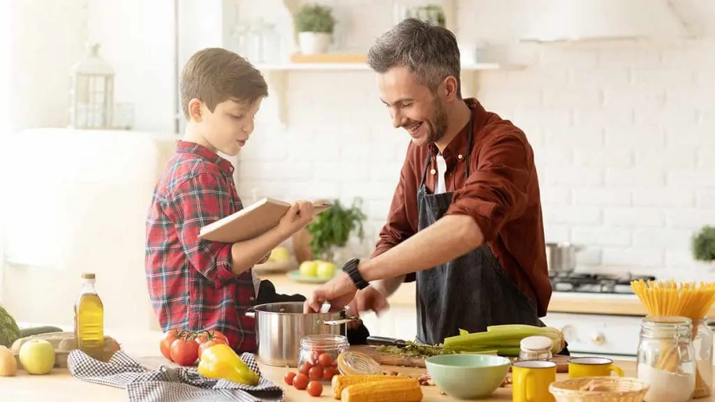 boy and dad cooking