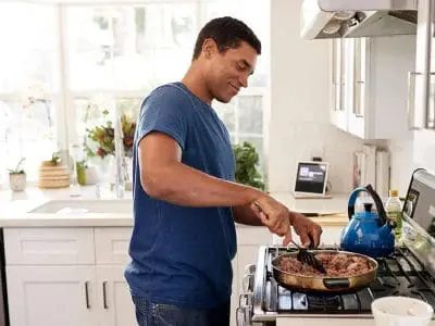 man cooking beef
