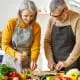 couple cutting vegetables
