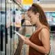 woman reading food label