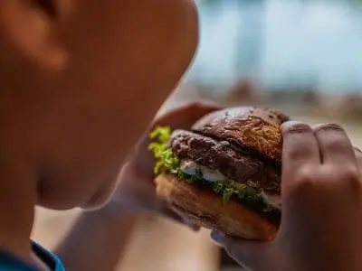 kid eating burger