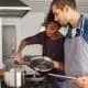 man and woman cooking