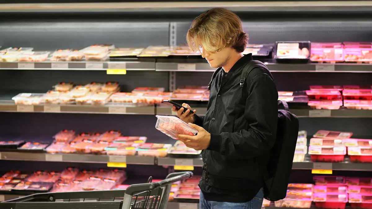 man buying meat
