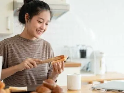 woman making toast