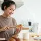 woman making toast