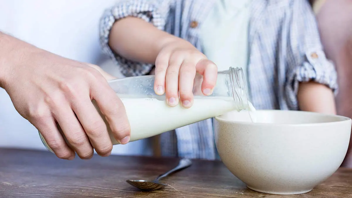 Boy-Dad-Pouring-Milk-Vitamin D