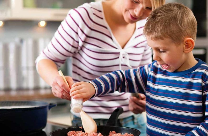child and parent cooking