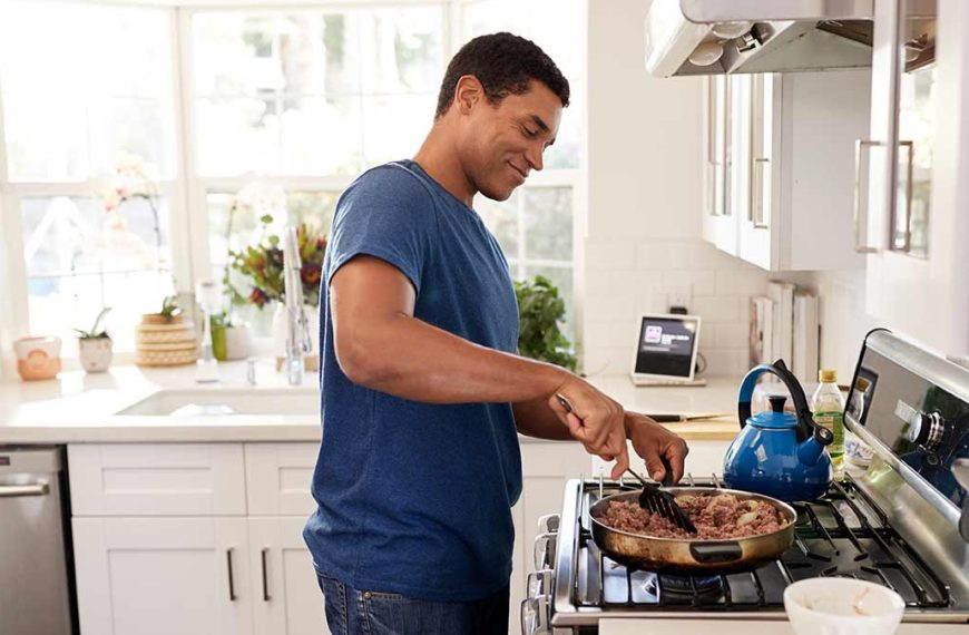 man cooking beef