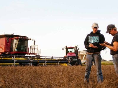 farmer and son in field