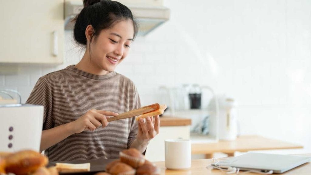 woman making toast